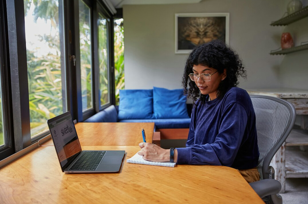 author writing at desk